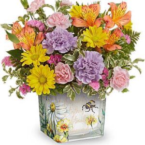 Colorful mixed flowers in decorative glass vase