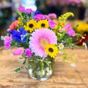 Vibrant mixed spring bouquet in glass vase